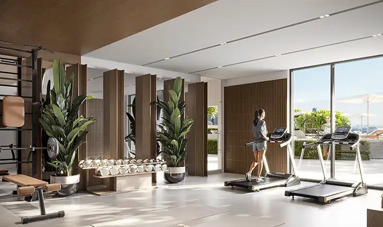 Modern gym with treadmills and strength equipment at IR1DIAN Park 2 JVC