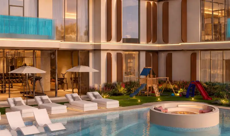 Resort-style swimming pool and children’s play area at Samana Portside Dubai
